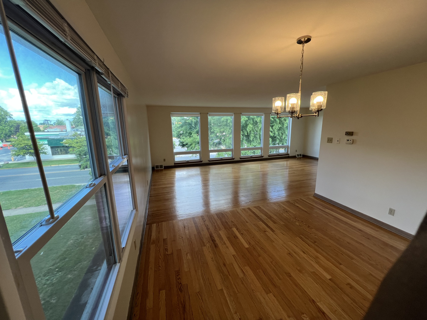 3014 Harlem Avenue, Unit 1 Riverside, IL 60546 - Photo 4 of 22 a view of empty room with wooden floor and fan