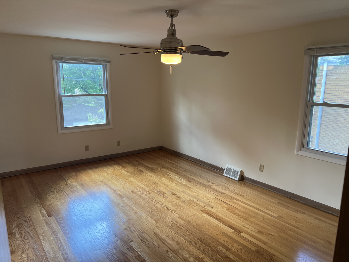 3014 Harlem Avenue, Unit 1 Riverside, IL 60546 - Photo 7 of 22 wooden floor in an empty room with a window