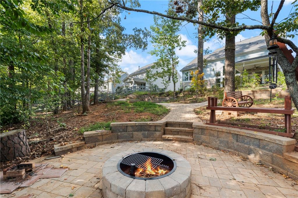 8110 Scenic Ridge Way Ball Ground, GA 30107 - Photo 21 of 29 a view of a swimming pool with a patio