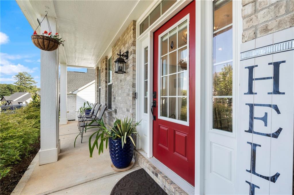 8110 Scenic Ridge Way Ball Ground, GA 30107 - Photo 22 of 29 a potted plant sitting on the side of a building