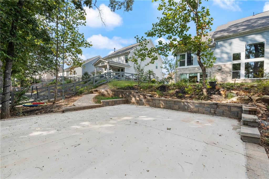 8110 Scenic Ridge Way Ball Ground, GA 30107 - Photo 23 of 29 a city street lined with buildings and trees