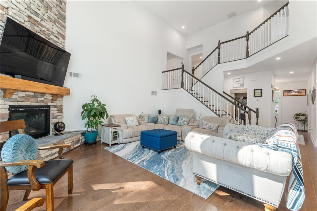 8110 Scenic Ridge Way Ball Ground, GA 30107 - Photo 3 of 29 a living room with furniture and a fireplace