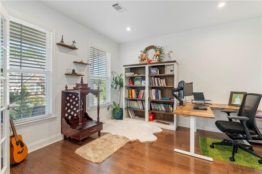 8110 Scenic Ridge Way Ball Ground, GA 30107 - Photo 7 of 29 a workspace with furniture bookshelf and a window