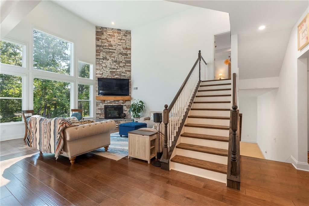 8110 Scenic Ridge Way Ball Ground, GA 30107 - Photo 9 of 29 a living room with furniture and a fireplace