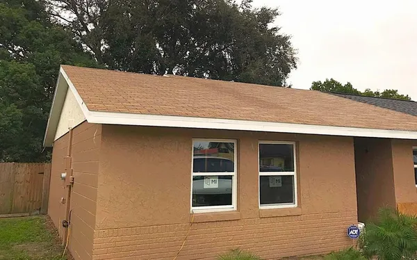 a view of a house with a tree