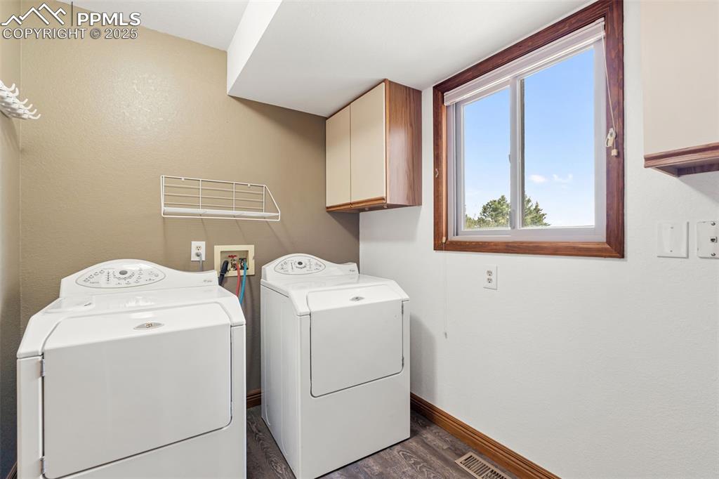 725 Bowstring Road Monument, CO 80132 - Photo 20 of 50 a utility room with dryer and washer