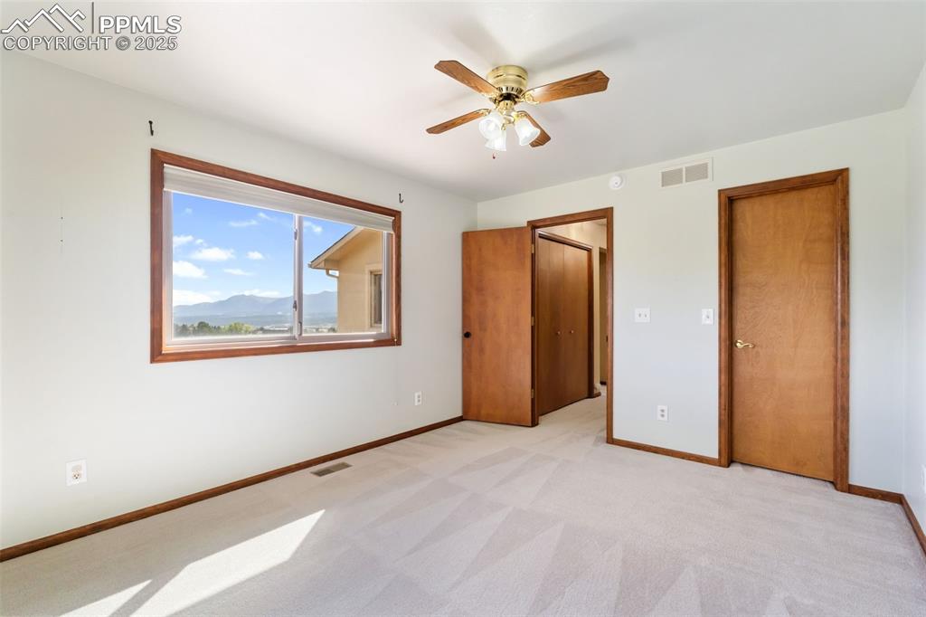 725 Bowstring Road Monument, CO 80132 - Photo 25 of 50 a view of an empty room with a window
