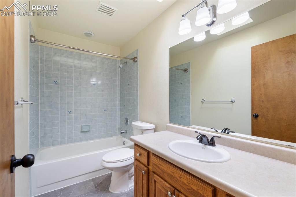 725 Bowstring Road Monument, CO 80132 - Photo 26 of 50 a bathroom with a sink a toilet and shower