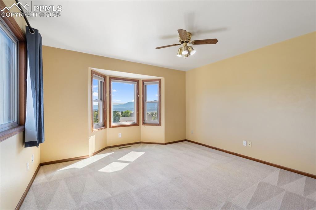 725 Bowstring Road Monument, CO 80132 - Photo 27 of 50 a view of an empty room with a window