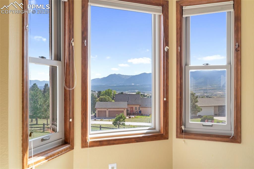 725 Bowstring Road Monument, CO 80132 - Photo 28 of 50 a view of a room that has a large window in front of a house