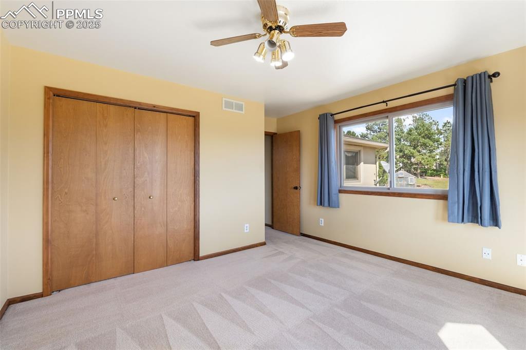 725 Bowstring Road Monument, CO 80132 - Photo 29 of 50 a view of an empty room with a window