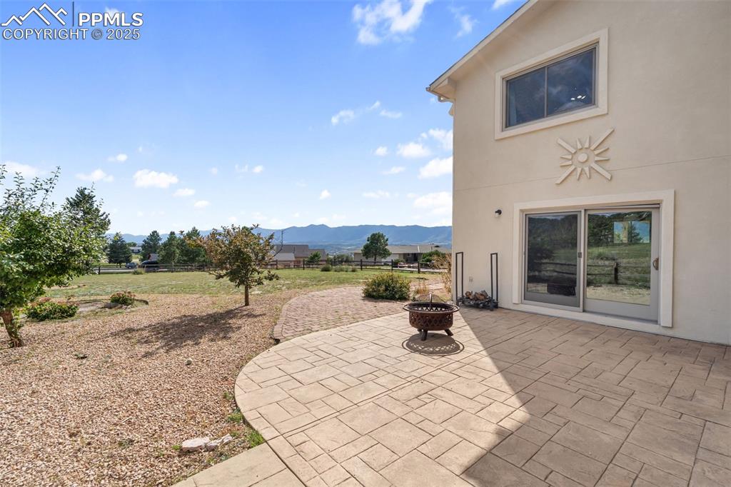 725 Bowstring Road Monument, CO 80132 - Photo 36 of 50 a view of a swimming pool with a lounge chair