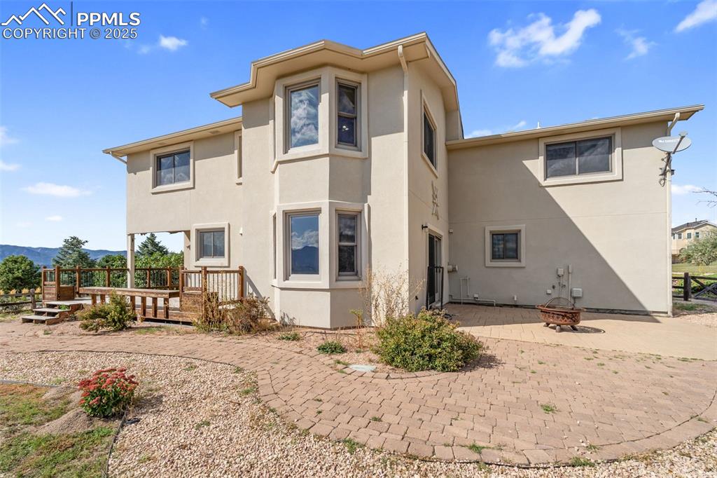 725 Bowstring Road Monument, CO 80132 - Photo 38 of 50 a view of a house with a snow in the background