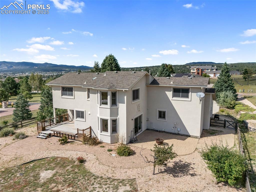 725 Bowstring Road Monument, CO 80132 - Photo 44 of 50 a view of a white house with a bath tub