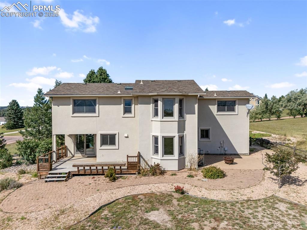 725 Bowstring Road Monument, CO 80132 - Photo 45 of 50 a front view of a house with a yard