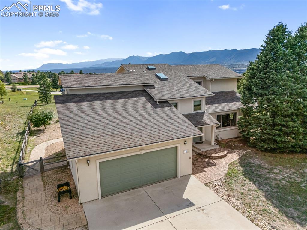 725 Bowstring Road Monument, CO 80132 - Photo 47 of 50 an aerial view of a house with a yard