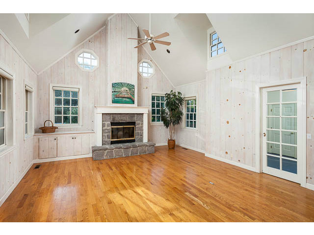 5070 Alpine Road Portola Valley, CA 94028 - Photo 5 of 15 a view of empty room with a fireplace and wooden floor