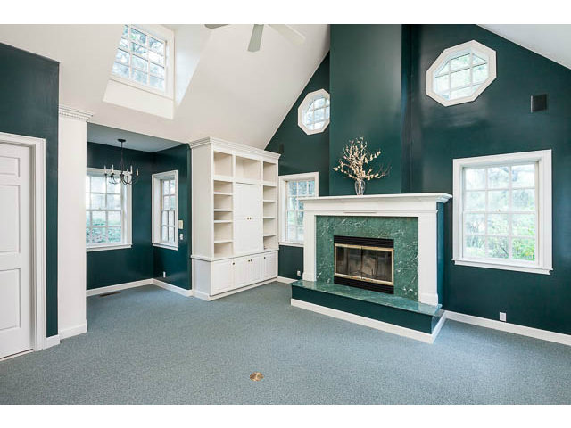 5070 Alpine Road Portola Valley, CA 94028 - Photo 10 of 15 a living room with furniture and a fireplace