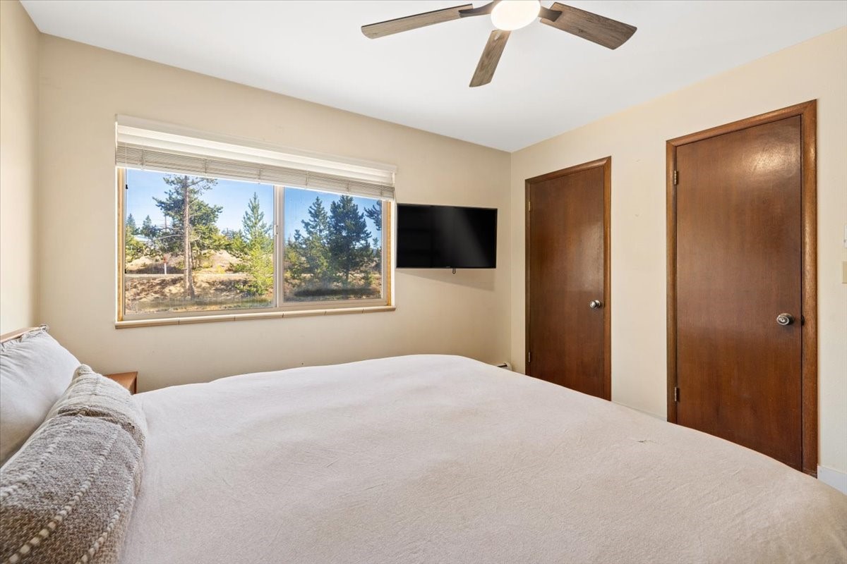 110 Evergreen Road, Unit 301 Dillon, CO 80435 - Photo 16 of 23 a bedroom with a large bed and a painting on the wall