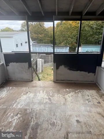 a view of a glass door with a yard