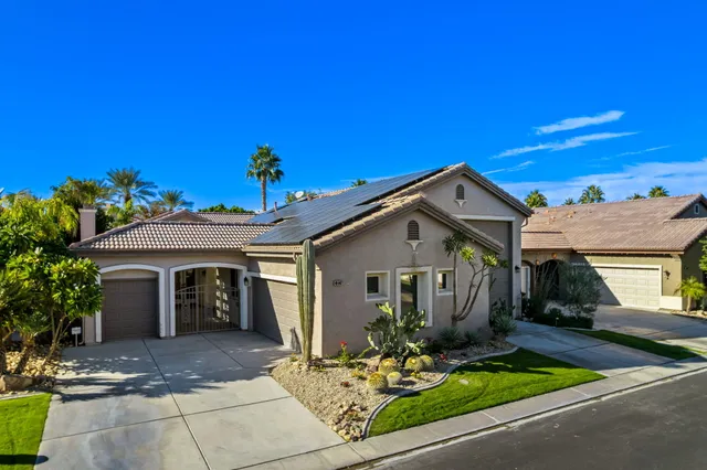 a front view of a house with yard