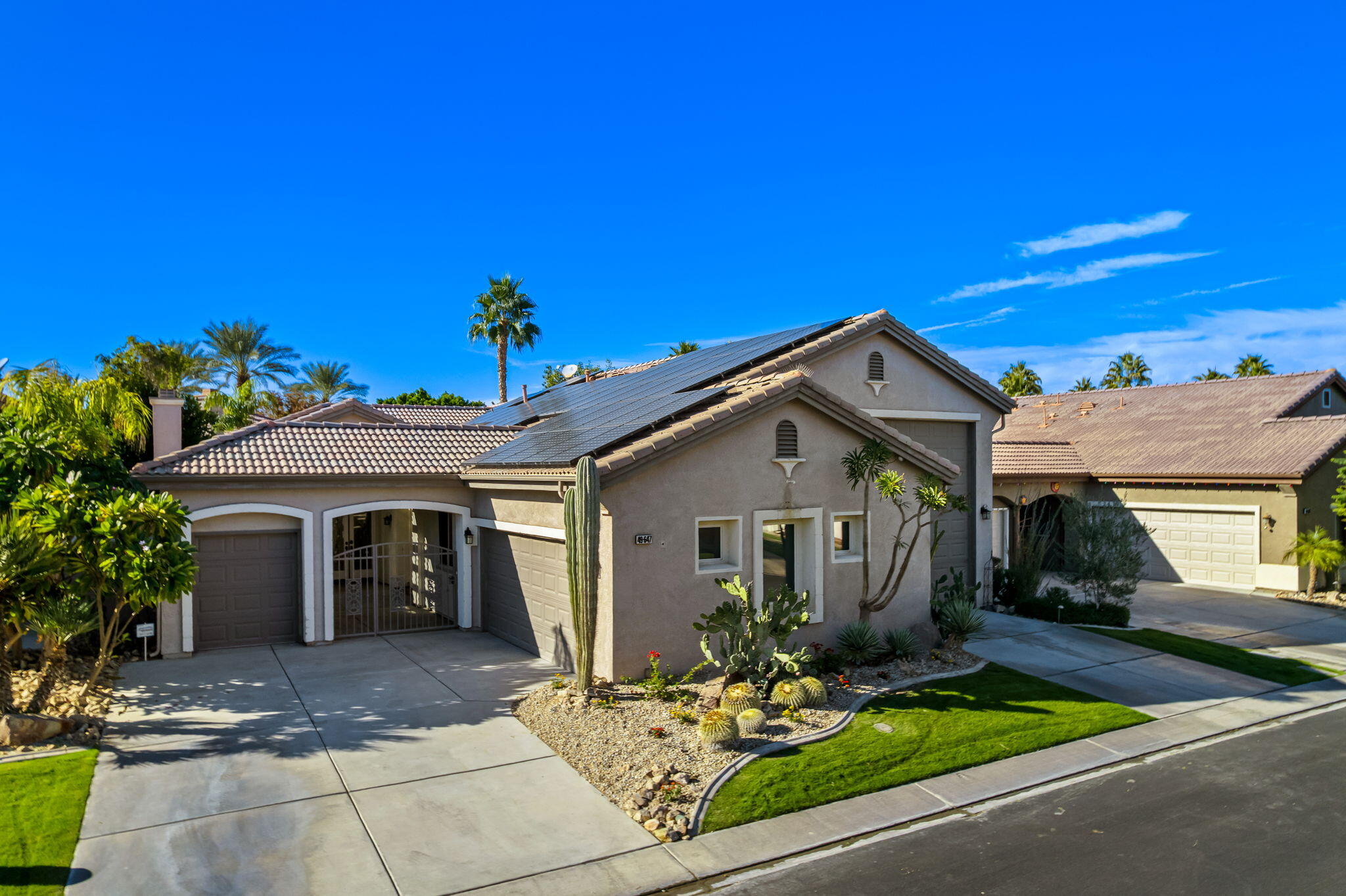 49647 Lewis Road Indio, CA 92201 - Photo 1 of 42 a front view of a house with yard