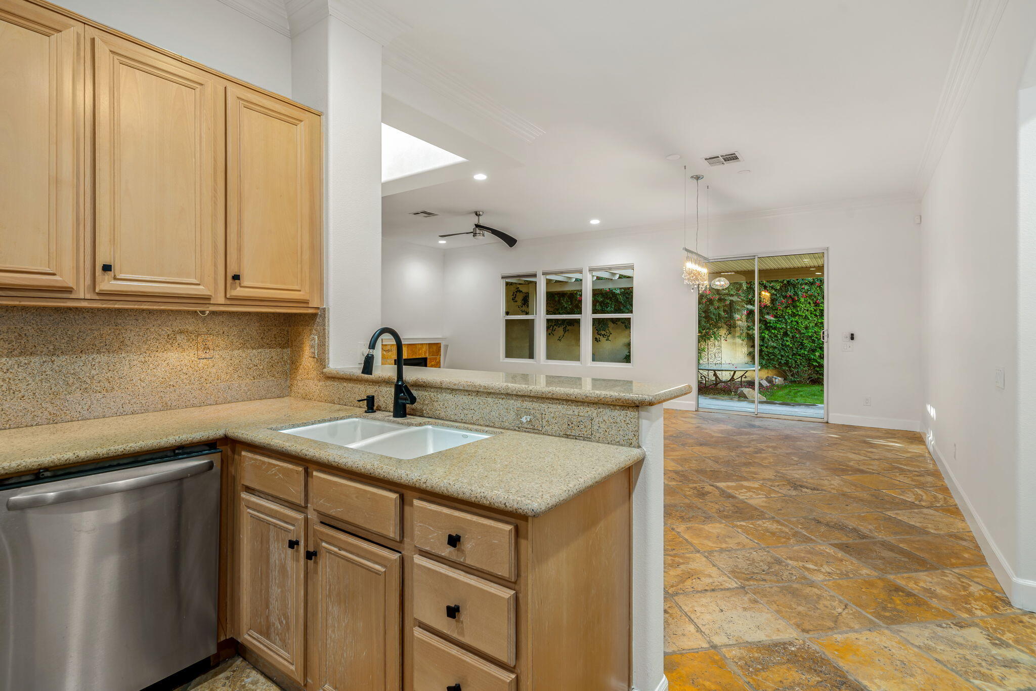 49647 Lewis Road Indio, CA 92201 - Photo 17 of 42 a kitchen with a sink cabinets and window