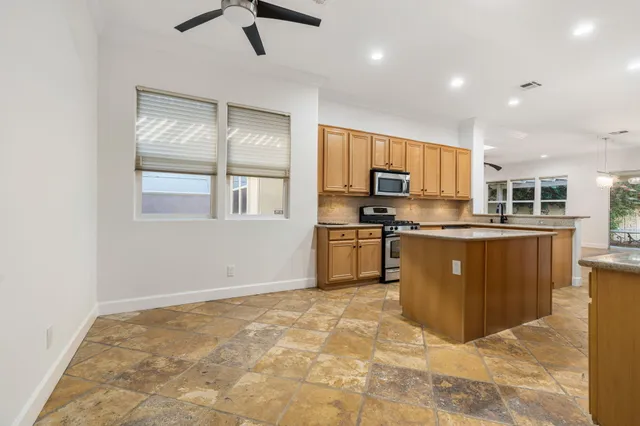 a spacious bedroom with a large bed and a couch