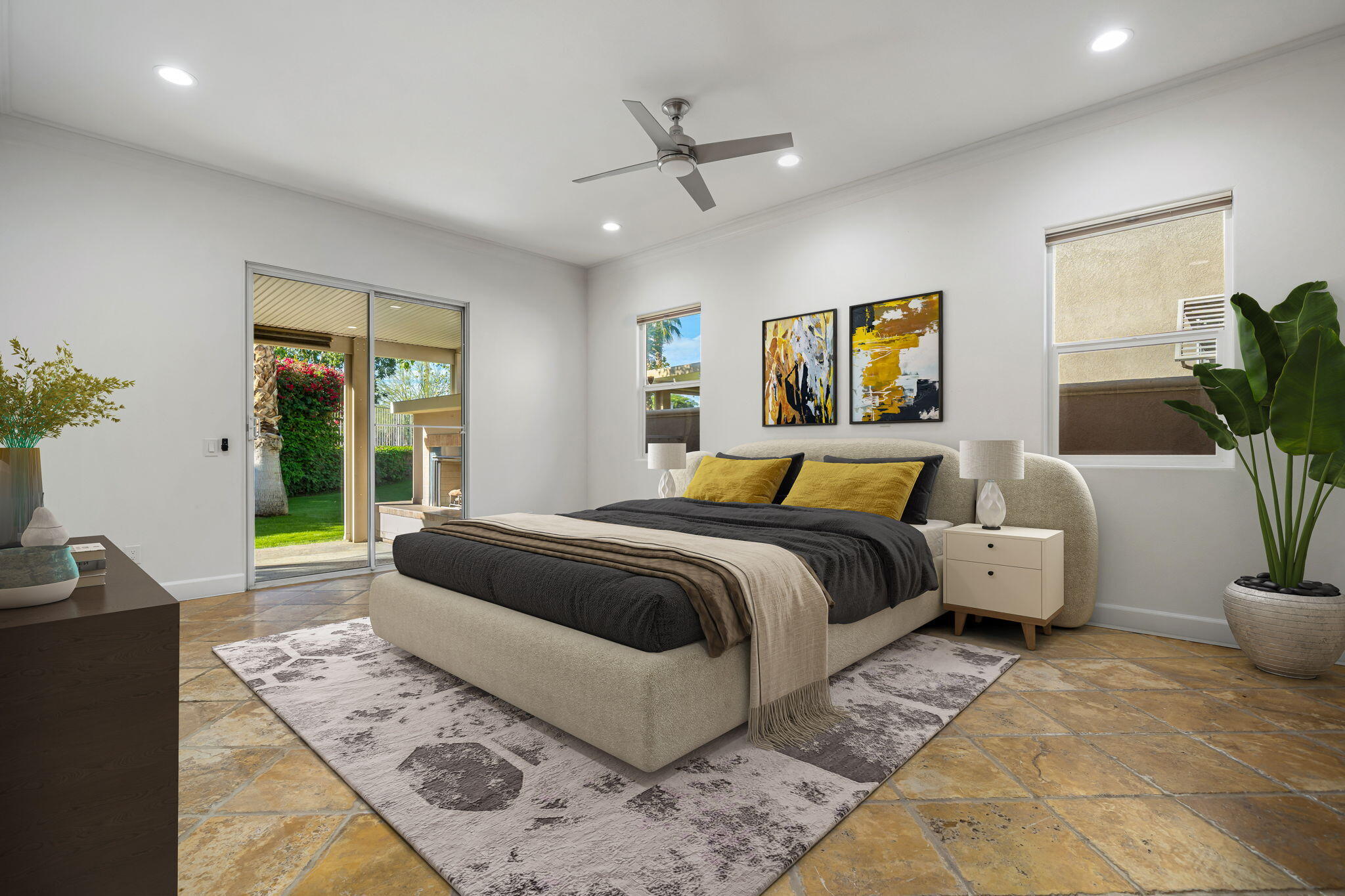 49647 Lewis Road Indio, CA 92201 - Photo 19 of 42 a spacious bedroom with a large bed and a couch