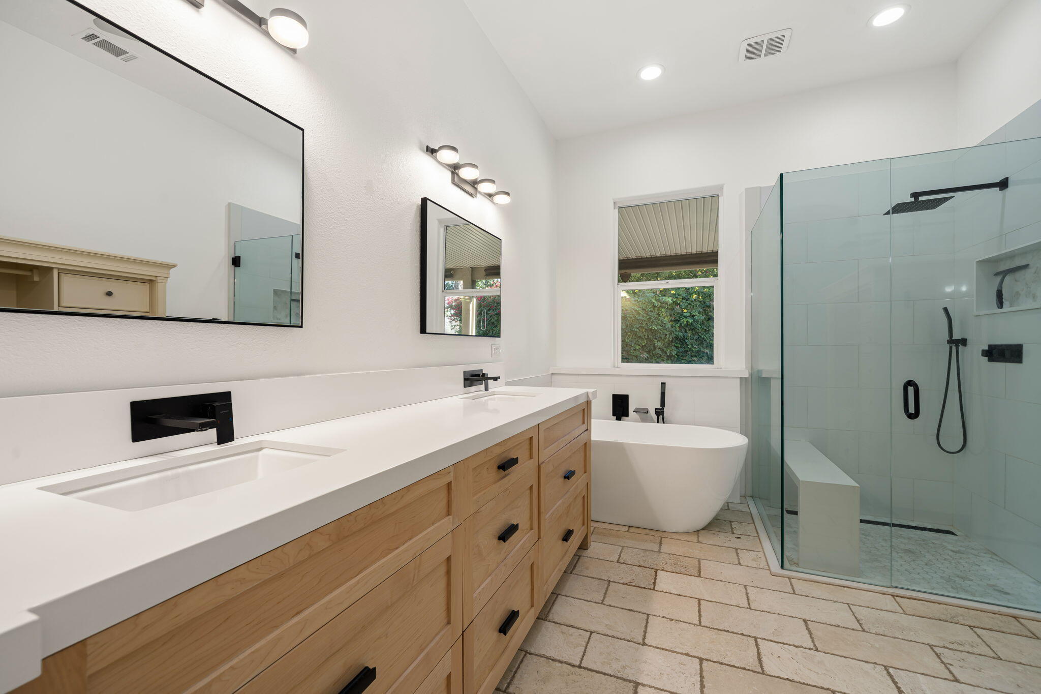 49647 Lewis Road Indio, CA 92201 - Photo 24 of 42 a spacious bathroom with a sink a toilet a mirror and shower
