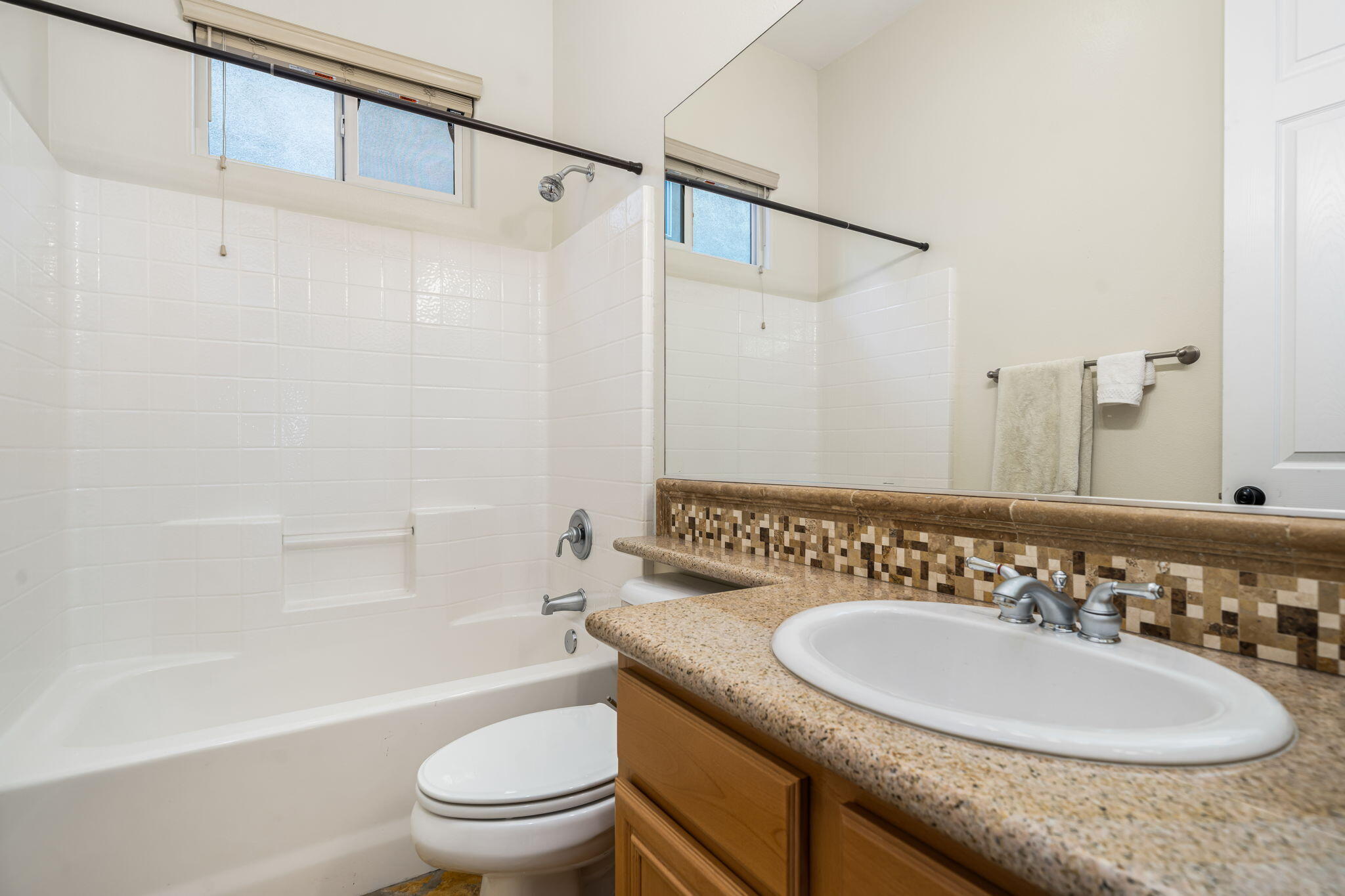 49647 Lewis Road Indio, CA 92201 - Photo 29 of 42 a bathroom with a sink a toilet and a mirror