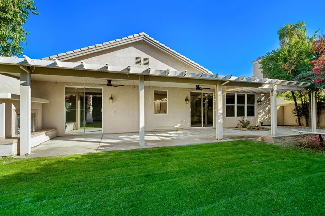 a front view of a house with a yard and porch