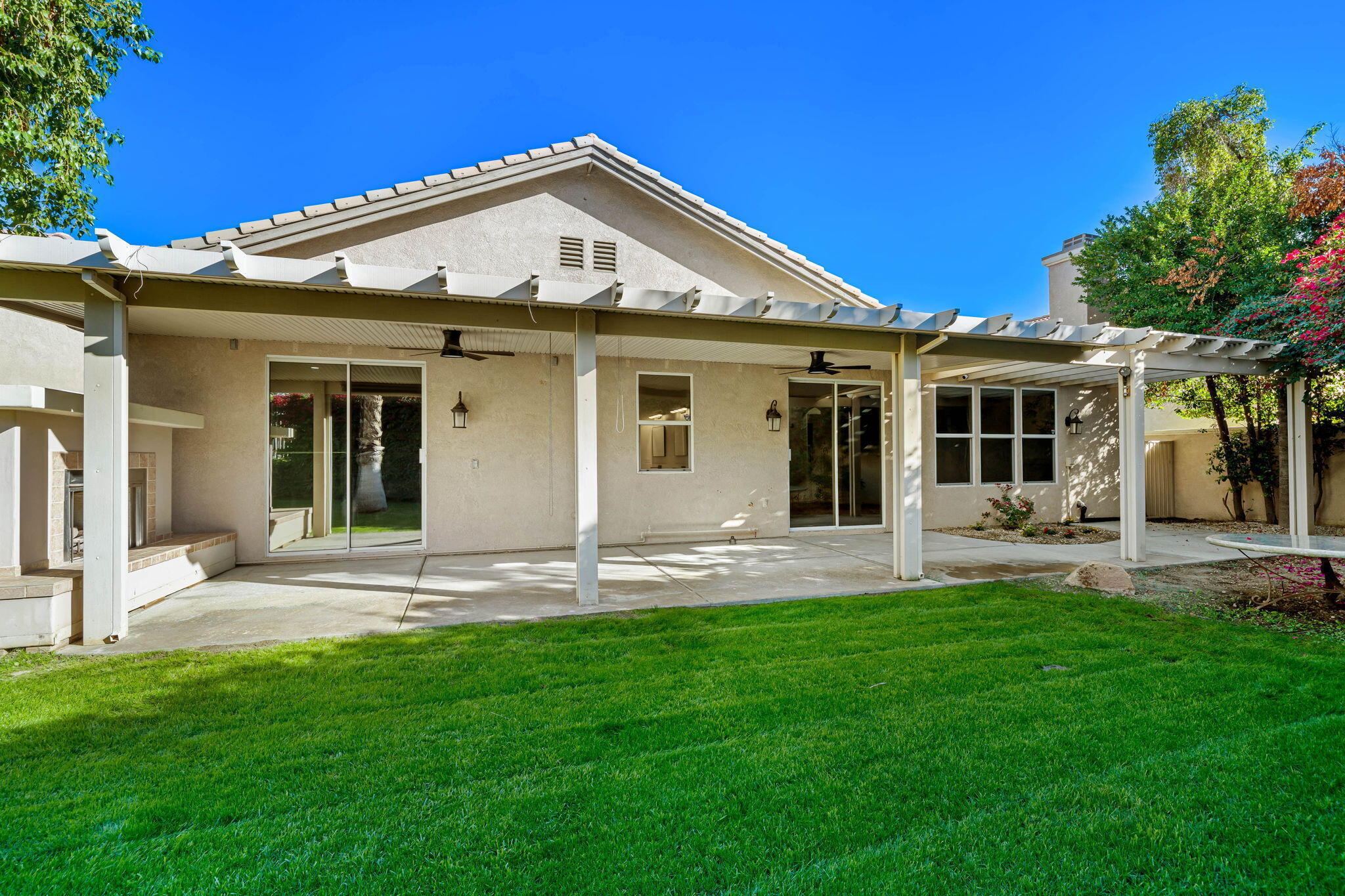 49647 Lewis Road Indio, CA 92201 - Photo 3 of 42 a front view of a house with a yard and porch