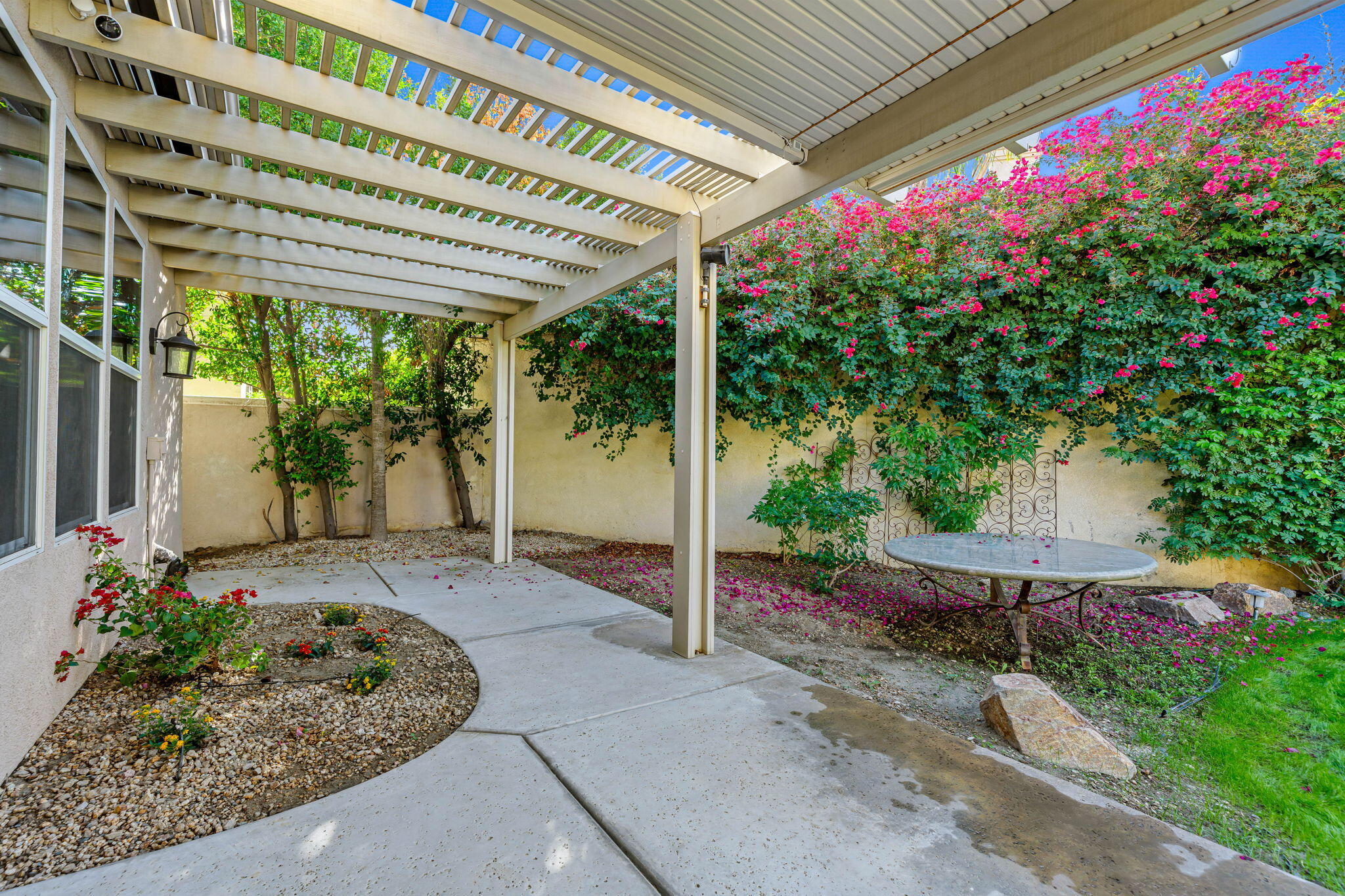 49647 Lewis Road Indio, CA 92201 - Photo 5 of 42 a view of a backyard with plants