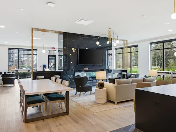 a kitchen with stainless steel appliances kitchen island granite countertop a stove a sink and a refrigerator