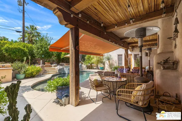 a view of a swimming pool with a patio