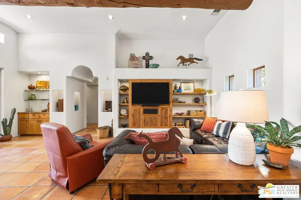 a view of a patio with swimming pool table and chairs