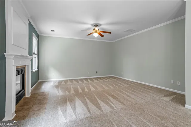 wooden floor in an empty room with a kitchen