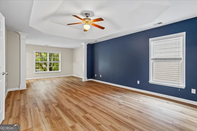 a spacious bathroom with a tub and a sink