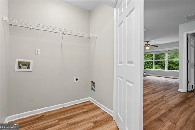 a kitchen with stainless steel appliances granite countertop a sink and wooden cabinets