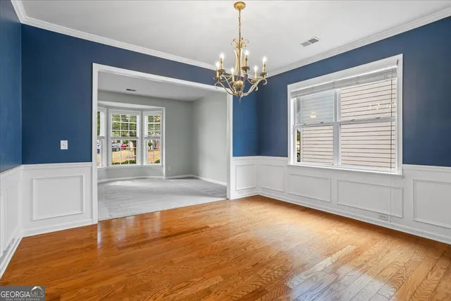 a kitchen with granite countertop wooden cabinets and a stove top oven