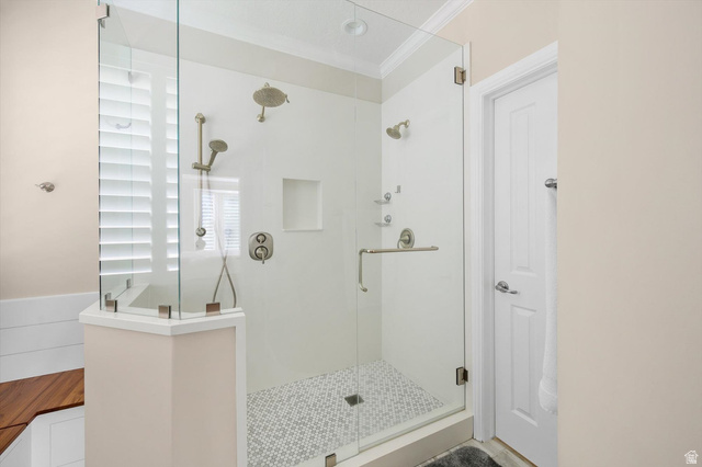 1456 Firelight Way Sandy, UT 84092 - Photo 8 of 22 Bathroom with a stall shower and crown molding