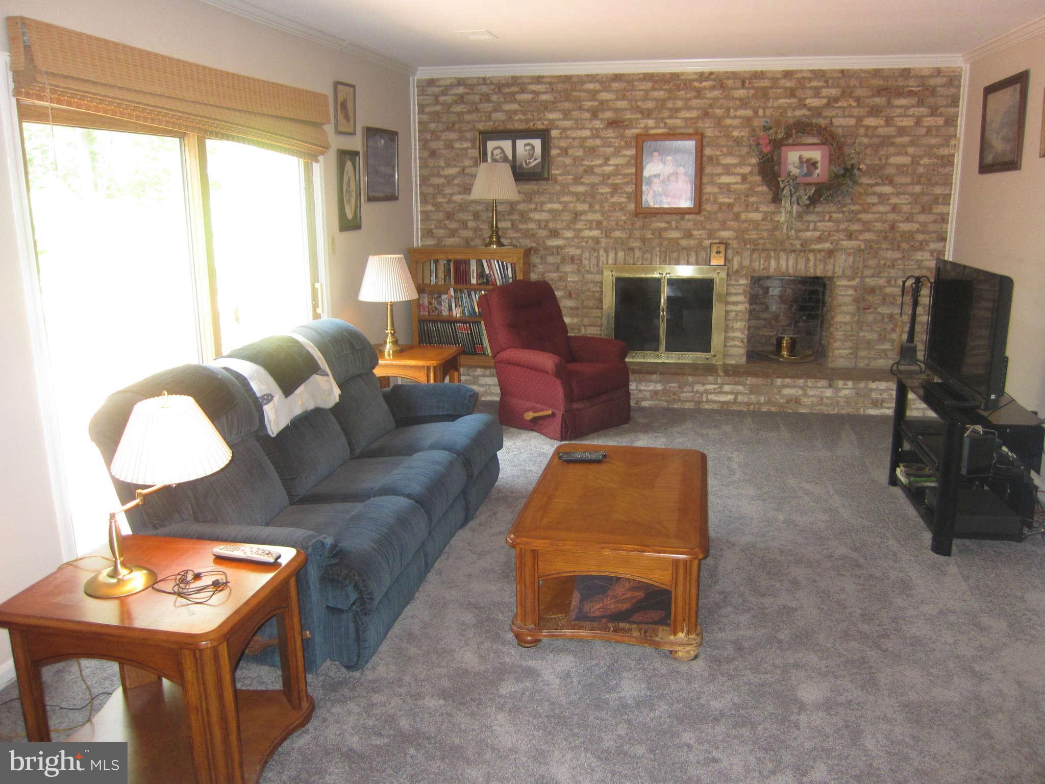 Family Room with brick hearth fireplace