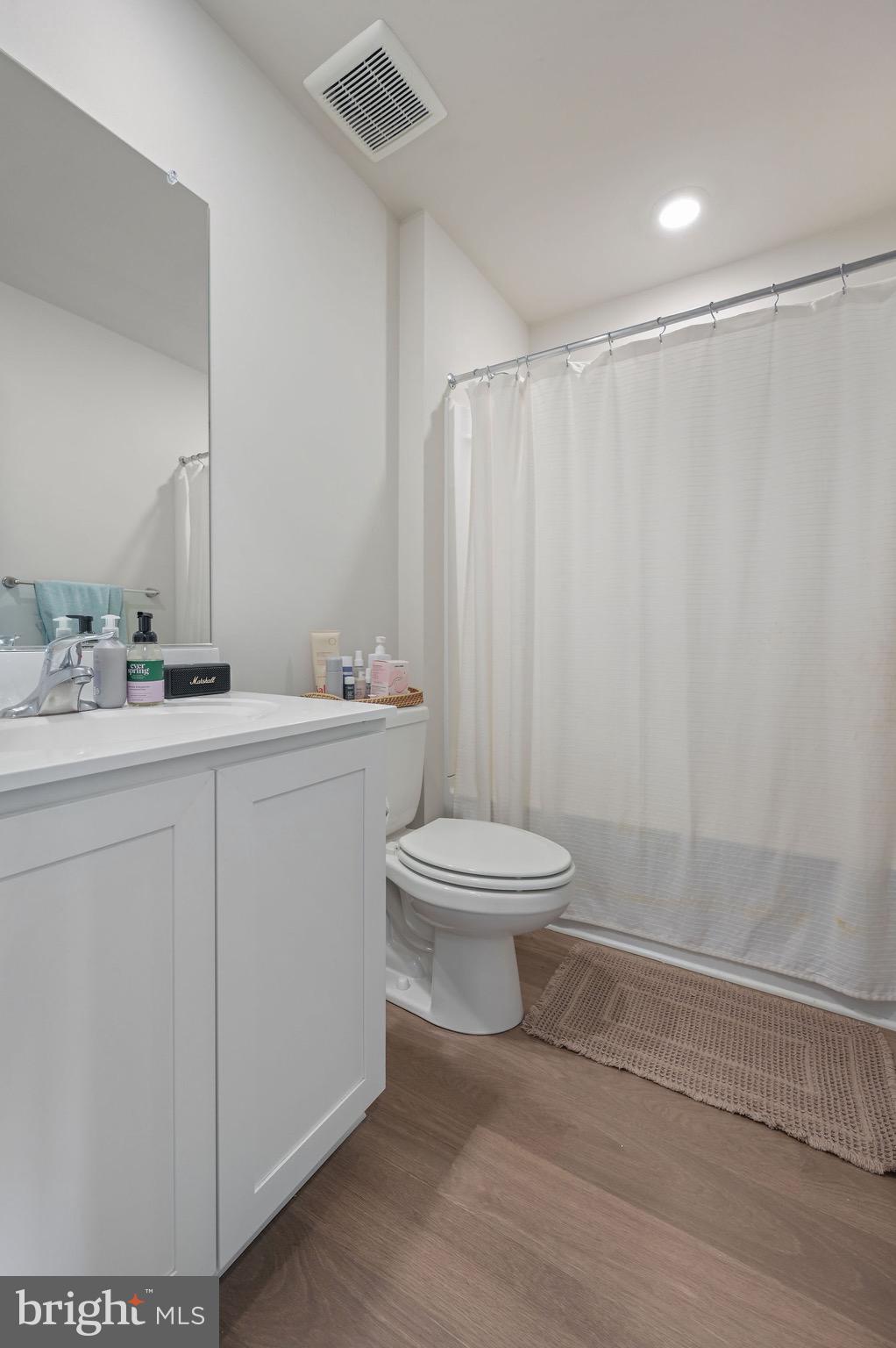 203 Ridgley Boulevard Dover, DE 19904 - Photo 11 of 12 a bathroom with a toilet a sink and a shower