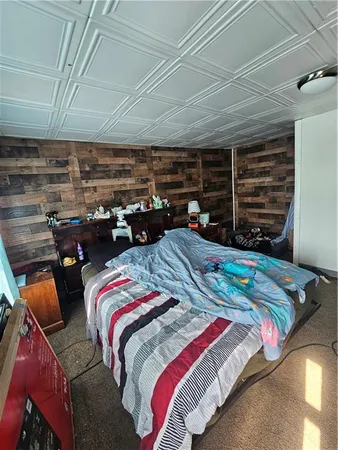 a bedroom with bed and a walk in closet