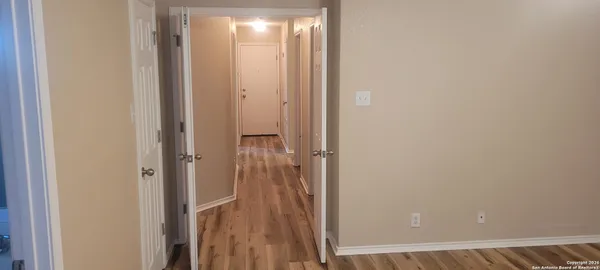 a view of a bathroom from a hallway