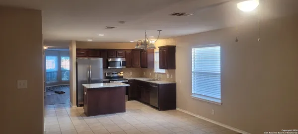 a view of a kitchen and kitchen island