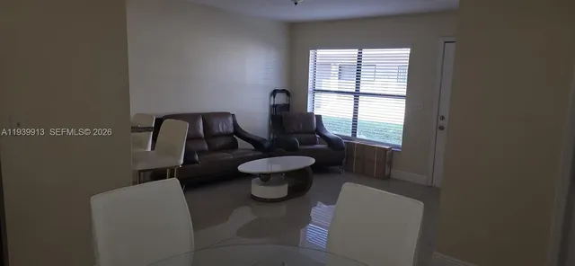 a bathroom with a toilet sink and window