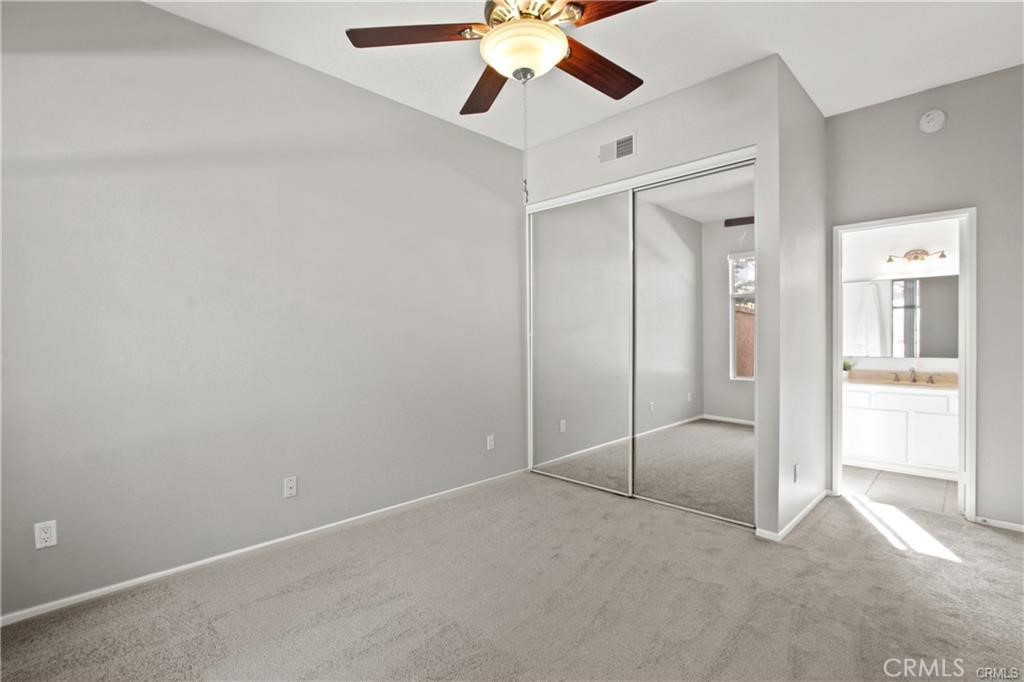 19431 Rue De Valore, Unit 49A Lake Forest, CA 92610 - Photo 18 of 23 an empty room with fan and entryway