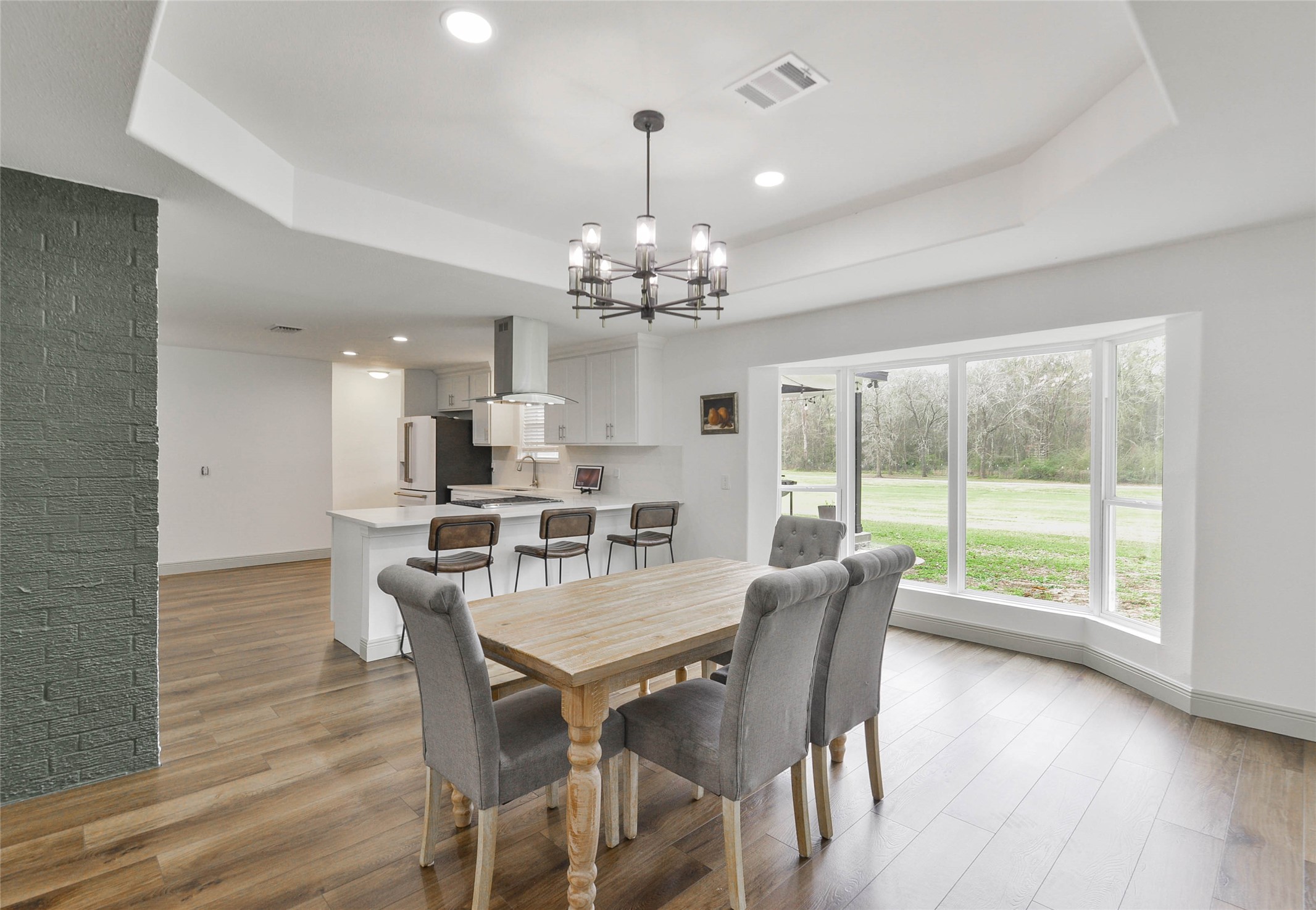 531 Brandon Road Conroe, TX 77302 - Photo 26 of 33 a very nice looking dining room with furniture window and wooden floor